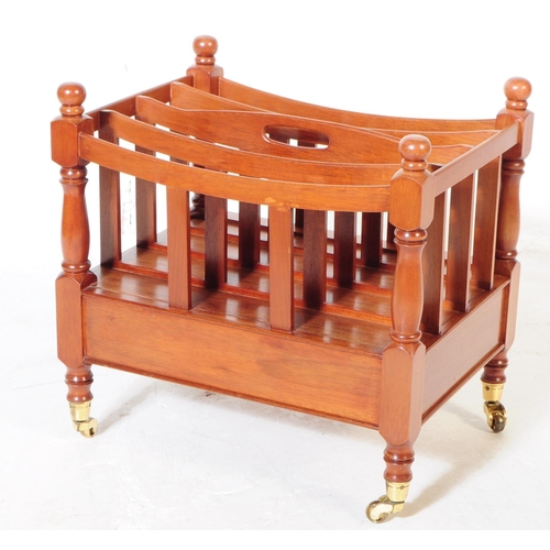 978 - A Canterbury style mahogany magazine rack with drawer, having turned columns and rounded finials. Up... 