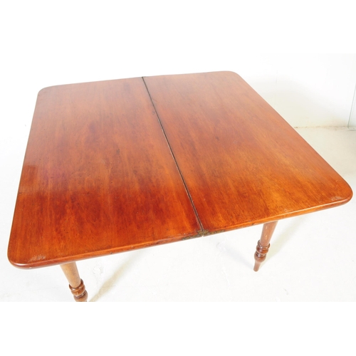 988 - A 19th century mahogany card / game table. The table having swivel action folding top with compartme... 