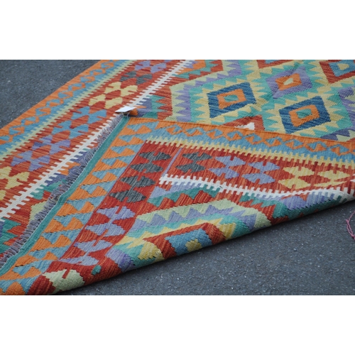 1003 - A vintage 20th century Anatolian Turkish kilim carpet floor rug. With geometric pattern to centre, r... 