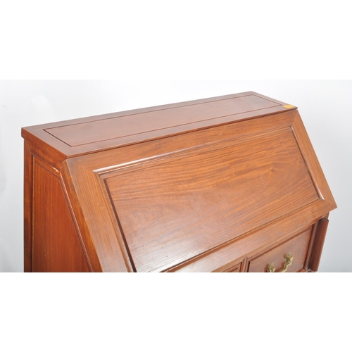 901 - A contemporary Chinese hardwood writing desk bureau. Rectangular form with sloped pull down door to ... 