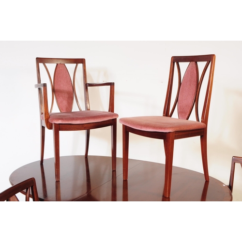 662 - G-Plan - A mid 20th century G-Plan mahogany dining table and four Fresco range dining chairs. The ta... 