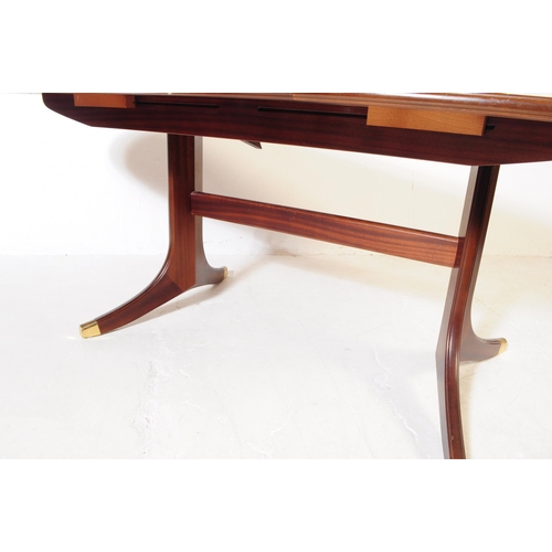 662 - G-Plan - A mid 20th century G-Plan mahogany dining table and four Fresco range dining chairs. The ta... 