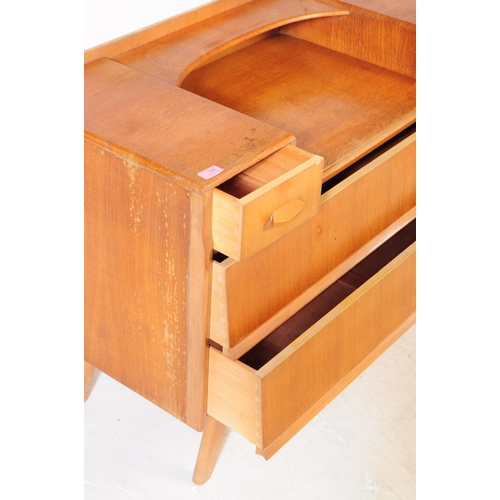 664 - British Modern Design - A retro mid 20th century light oak chest of drawers. The chest of drawers ra... 