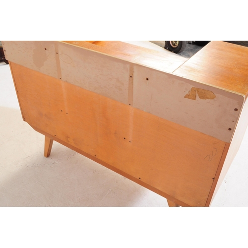 664 - British Modern Design - A retro mid 20th century light oak chest of drawers. The chest of drawers ra... 