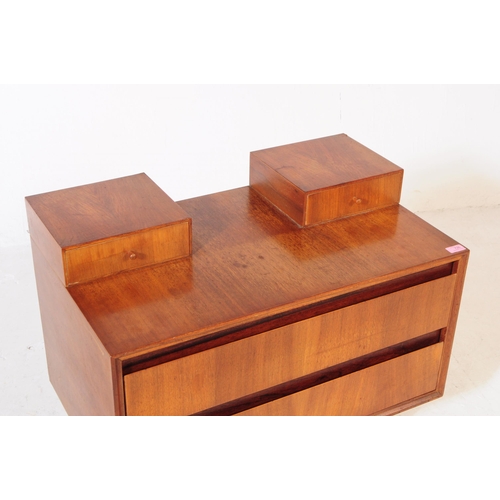 665 - Meredew Furniture - A mid 20th century Meredew Furniture teak wood chest of drawers. The chest of dr... 