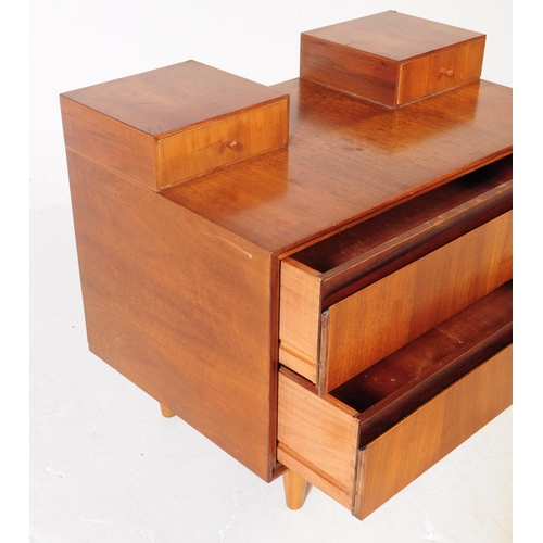 665 - Meredew Furniture - A mid 20th century Meredew Furniture teak wood chest of drawers. The chest of dr... 