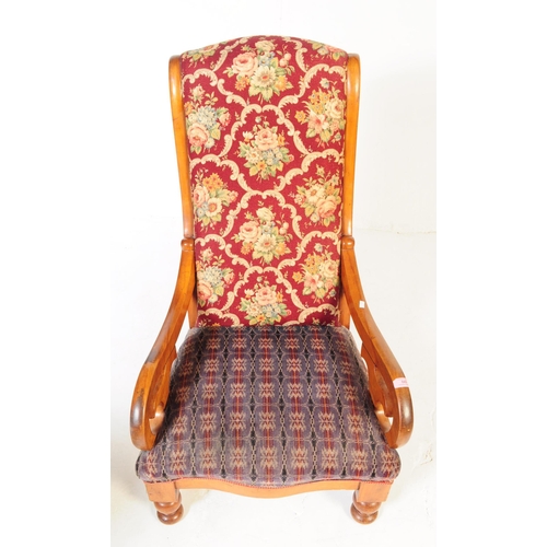 970 - A Victorian 19th century walnut lounge armchair.  Having a large padded cushioned backrest and seat.... 