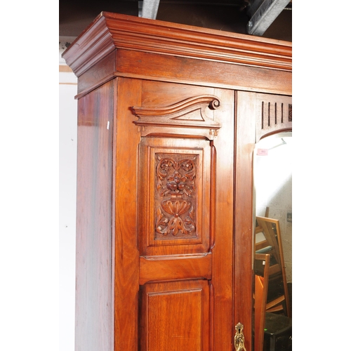 973 - An early 20th century Edwardian arts and crafts circa 1900s walnut double wardrobe closet. Having a ... 