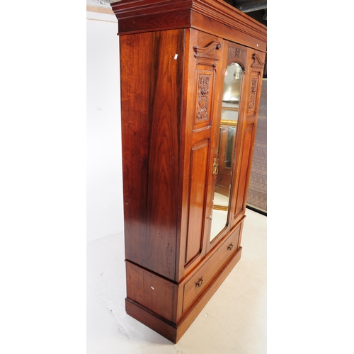 973 - An early 20th century Edwardian arts and crafts circa 1900s walnut double wardrobe closet. Having a ... 