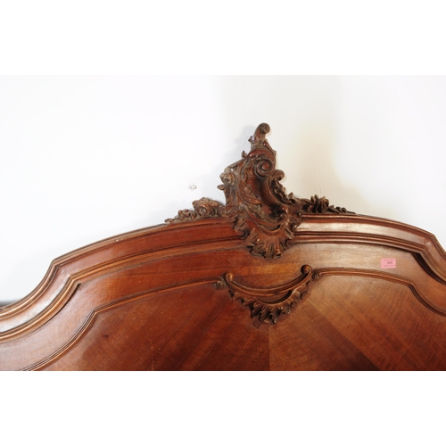 979 - A 19th century French Louis XV style walnut three quarter double bed frame, head and footboard. The ... 