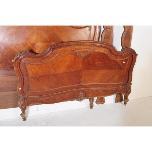 979 - A 19th century French Louis XV style walnut three quarter double bed frame, head and footboard. The ... 