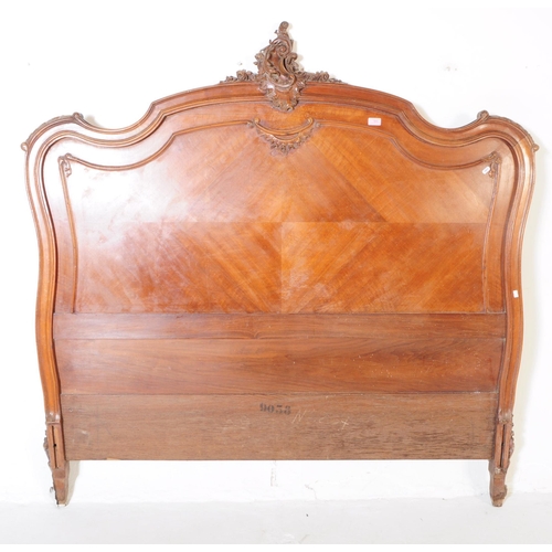 979 - A 19th century French Louis XV style walnut three quarter double bed frame, head and footboard. The ... 