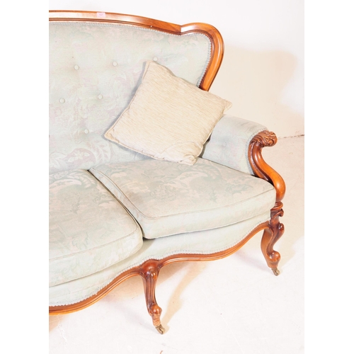 981 - A Italian rococo revival three seater sofa / settee. Having a mahogany frame with green upholstered ... 