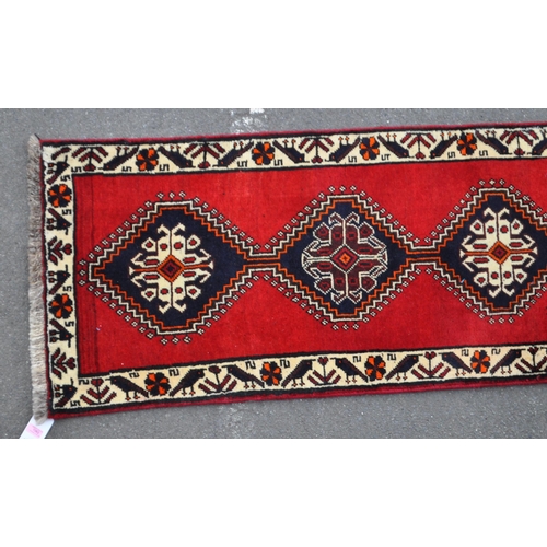 997 - A vintage 20th century South West Persian Qashqai carpet floor runner rug. Having repeating central ... 