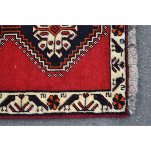 997 - A vintage 20th century South West Persian Qashqai carpet floor runner rug. Having repeating central ... 