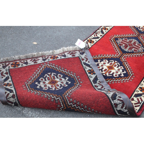 997 - A vintage 20th century South West Persian Qashqai carpet floor runner rug. Having repeating central ... 