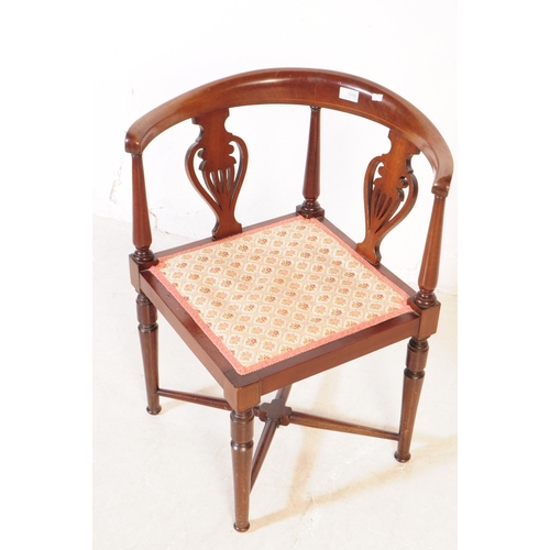 1050 - A 19th Century Victorian mahogany corner chair having pierced back design with floral upholstered se... 