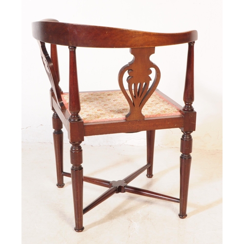 1050 - A 19th Century Victorian mahogany corner chair having pierced back design with floral upholstered se... 