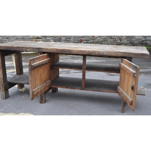 554 - A vintage 20th century large industrial factory wood working table. Of solid rectangular plank form ... 