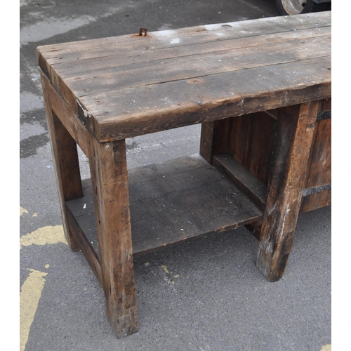 554 - A vintage 20th century large industrial factory wood working table. Of solid rectangular plank form ... 