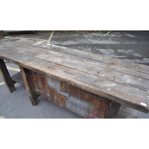 554 - A vintage 20th century large industrial factory wood working table. Of solid rectangular plank form ... 