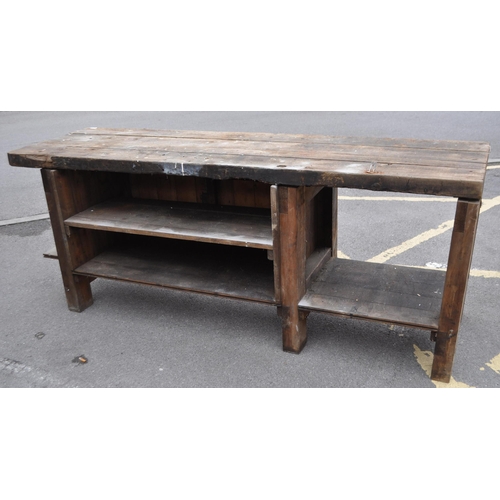 554 - A vintage 20th century large industrial factory wood working table. Of solid rectangular plank form ... 