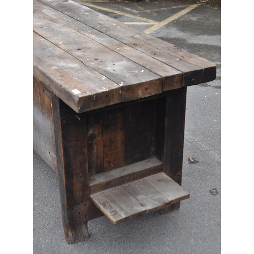 554 - A vintage 20th century large industrial factory wood working table. Of solid rectangular plank form ... 