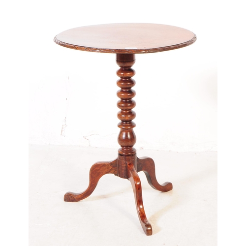 808 - A George III mahogany occasional side table. Of circular form with carved chamfered edge, bobbin tur... 