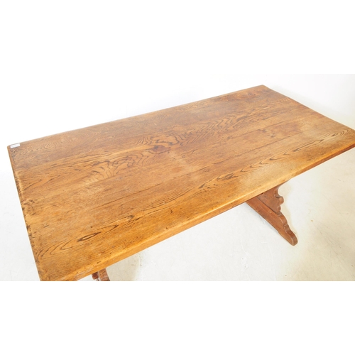 819 - An early 20th century oak country farmhouse oak refectory table. Rectangular form with trestle lyre ... 