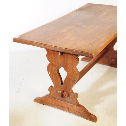 819 - An early 20th century oak country farmhouse oak refectory table. Rectangular form with trestle lyre ... 