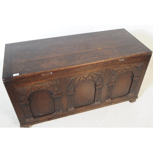 919 - A late 19th century Jacobean revival oak wood coffer chest. The chest raised on block feet with a tr... 