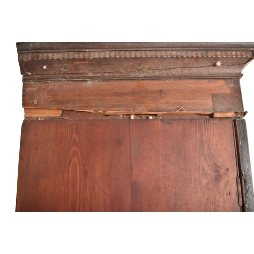 880 - A large early 20th century George III double mahogany wardrobe. Having a carved cornice to top, twin... 