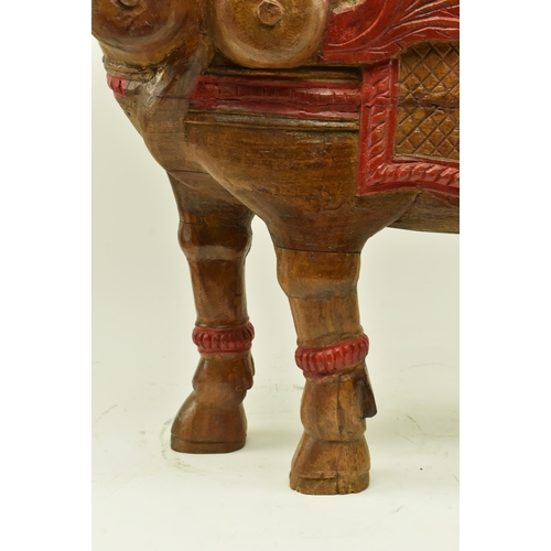 222 - An Indian Oriental 20th century hand carved painted hardwood sculpture of Kamadhenu or Surabhi. The ... 