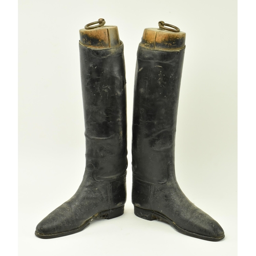 22 - A pair of vintage 20th century black leather riding boots with shoe trees to each. Each measures app... 