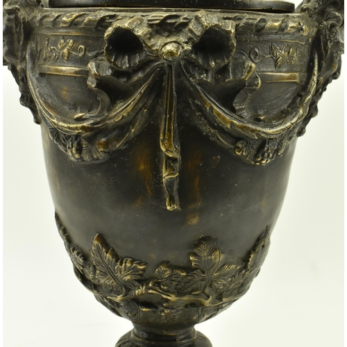 24 - A Victorian 19th century Grand Tour cast bronze lidded urn vase. The urn having a foliate shaped lid... 