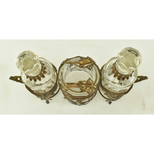 36 - A French Art Nouveau late 19th century glass & ormolu condiment set. The set comprising of two bottl... 