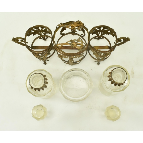 36 - A French Art Nouveau late 19th century glass & ormolu condiment set. The set comprising of two bottl... 