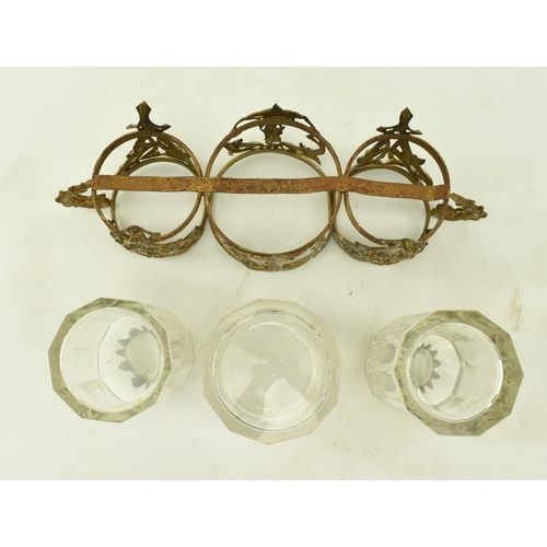 36 - A French Art Nouveau late 19th century glass & ormolu condiment set. The set comprising of two bottl... 