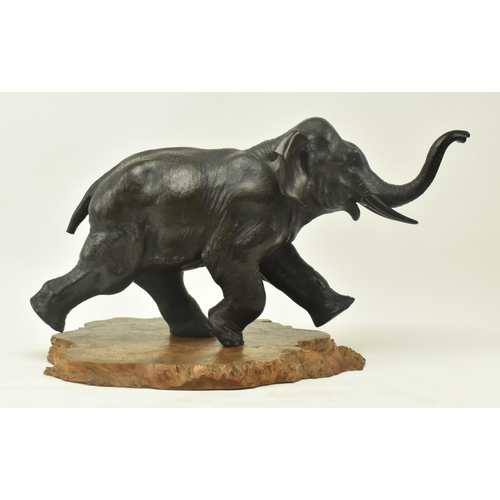 40 - A Japanese 19th century Meiji period bronze sculpture figure depicting an elephant with raised trunk... 