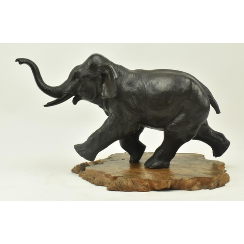 40 - A Japanese 19th century Meiji period bronze sculpture figure depicting an elephant with raised trunk... 