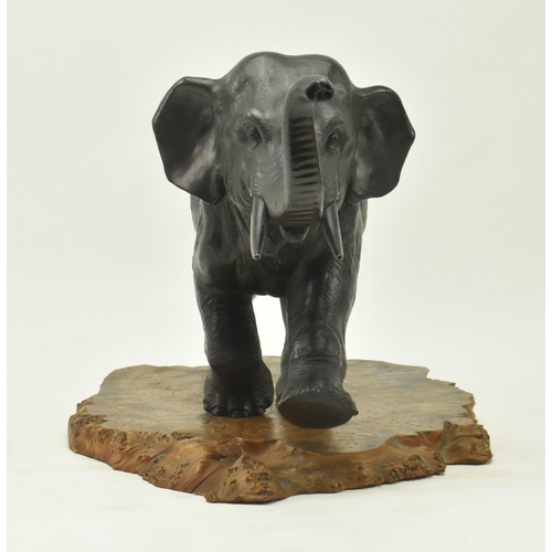 40 - A Japanese 19th century Meiji period bronze sculpture figure depicting an elephant with raised trunk... 