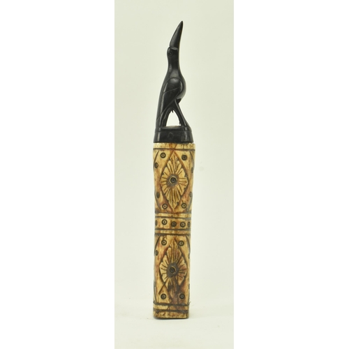 54 - A 19th century tribal possibly Native American bone and ebony medicinal powder flask. The flask feat... 