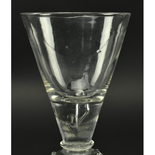 60 - A George I early 18th century English lead glass hand blown wine drinking glass. The glass having a ... 