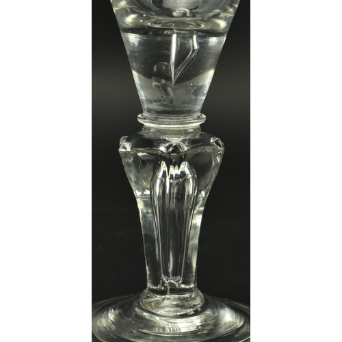 60 - A George I early 18th century English lead glass hand blown wine drinking glass. The glass having a ... 