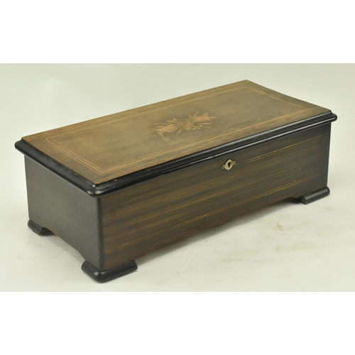 61 - A Swiss continental early 20th century rosewood & brushed walnut 8 airs cylinder music box. The musi... 