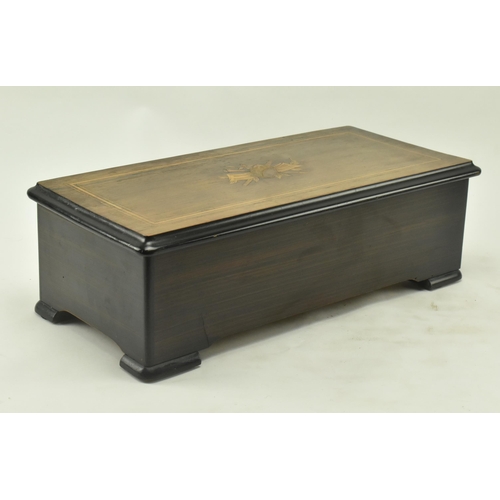 61 - A Swiss continental early 20th century rosewood & brushed walnut 8 airs cylinder music box. The musi... 