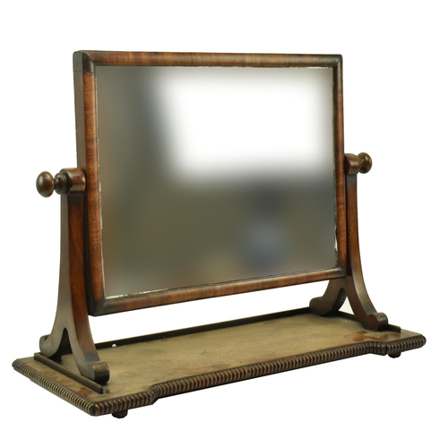 595 - A George III 19th century mahogany toilet swing mirror. The mirror having splayed supports over a ba... 