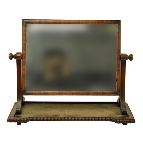 595 - A George III 19th century mahogany toilet swing mirror. The mirror having splayed supports over a ba... 