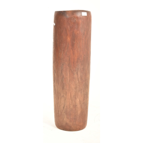 598 - A tall tribal inspired 20th century hand carved hardwood umbrella stand planter. The stand of cylind... 