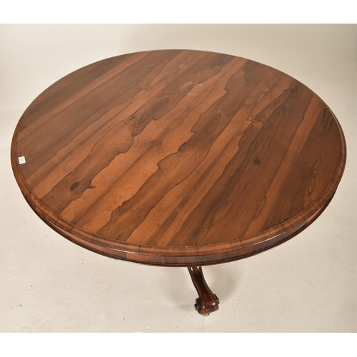 606 - A 19th century Victorian rosewood centre table / breakfast loo table. The table having a rounded top... 